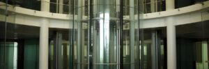 Glass tubular elevator in modern building